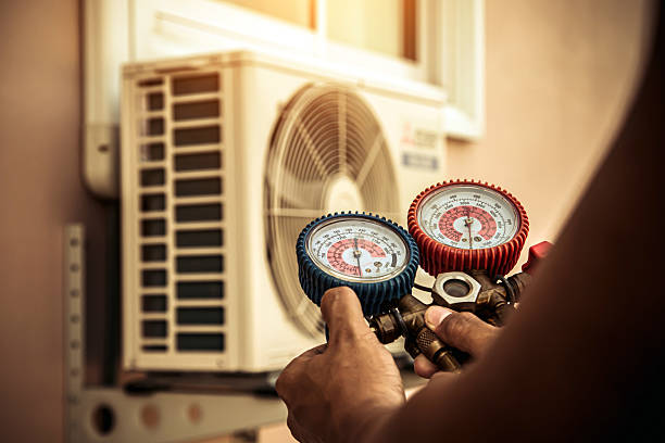 Professional Air Conditioning Service technician working in Westford, MA